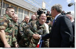 President George W. Bush greets base personnel of the 934th Airlift Wing of the Air National Guard at Minneapolis-St. Paul International Airport in Minneapolis, Minn., Monday, April 26, 2004.  White House photo by Paul Morse